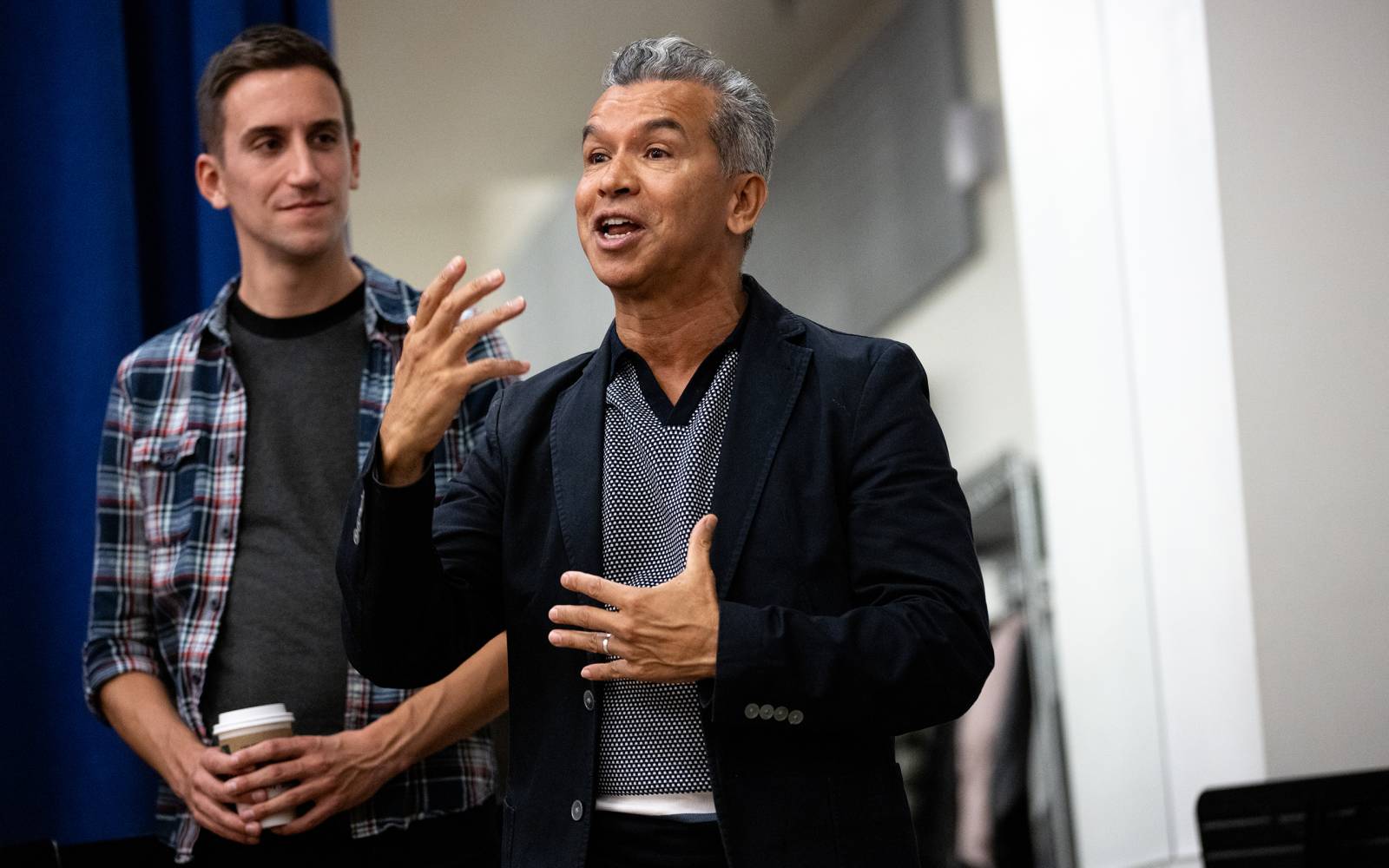 Sergio Trujillo talks to the cast with his assistant Alex Tobey behind him.