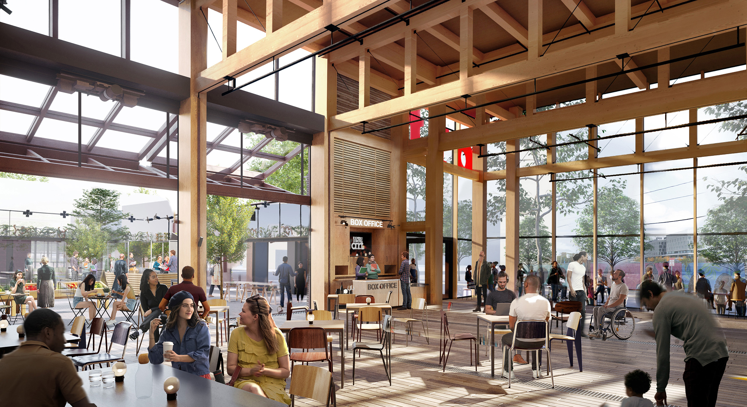 View of the lobby filled with people at cafe tables. The retractable wall is open, with additional seating in the courtyard.